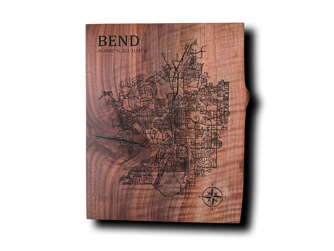 Wooden plaque with engraved map and 'Bend' text on a white background