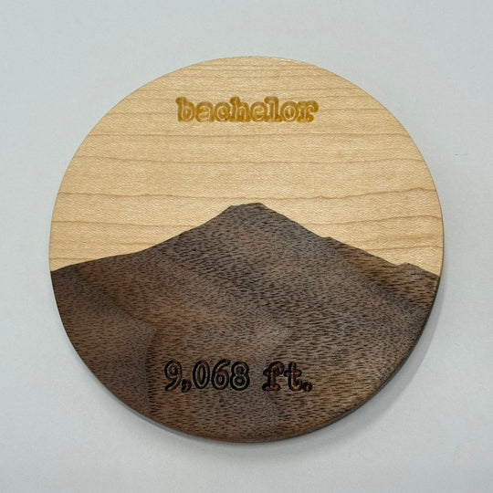 A wooden coaster on a white background.