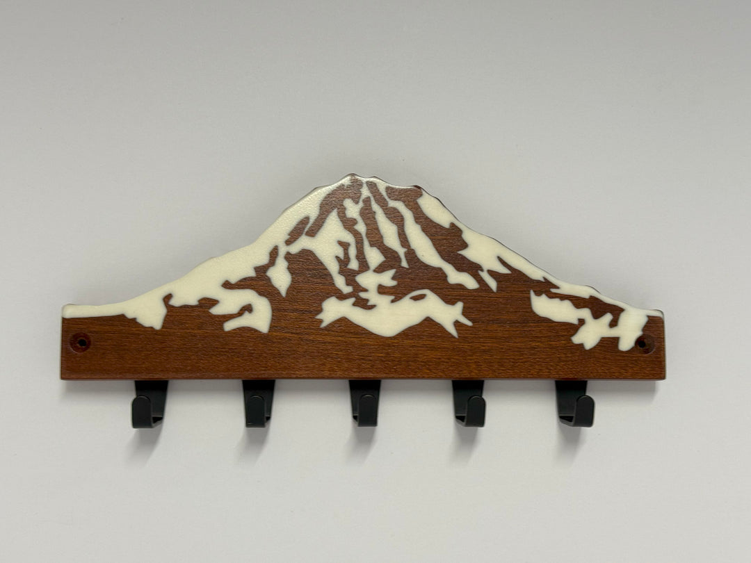 A wooden keyholder on a white background.