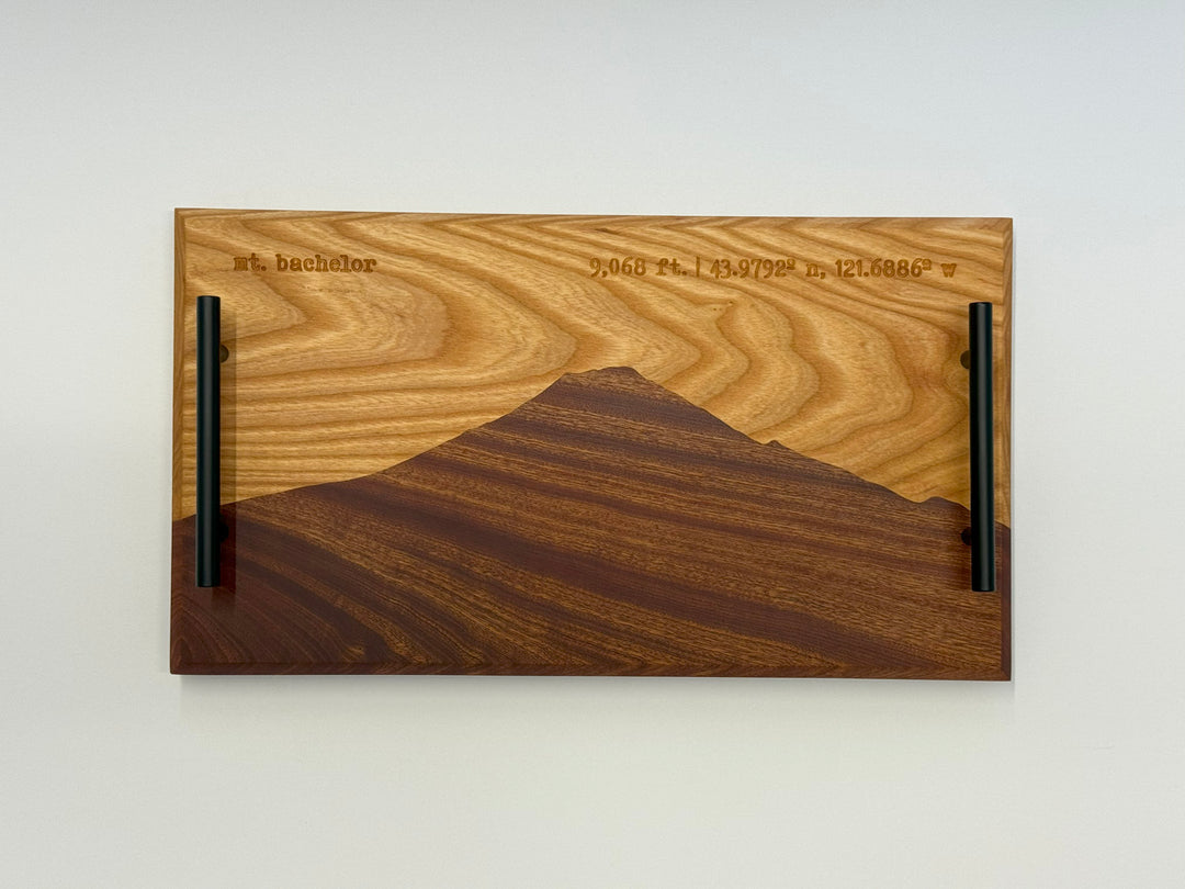 A wooden platter on a white background.
