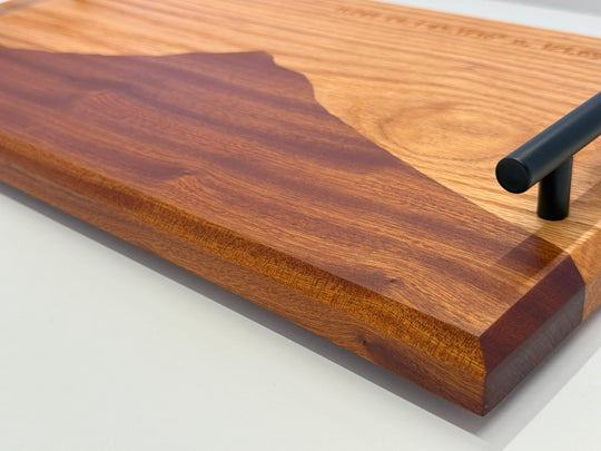 A wooden platter on a white background.