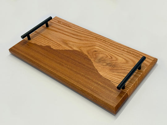 A wooden platter on a white background.